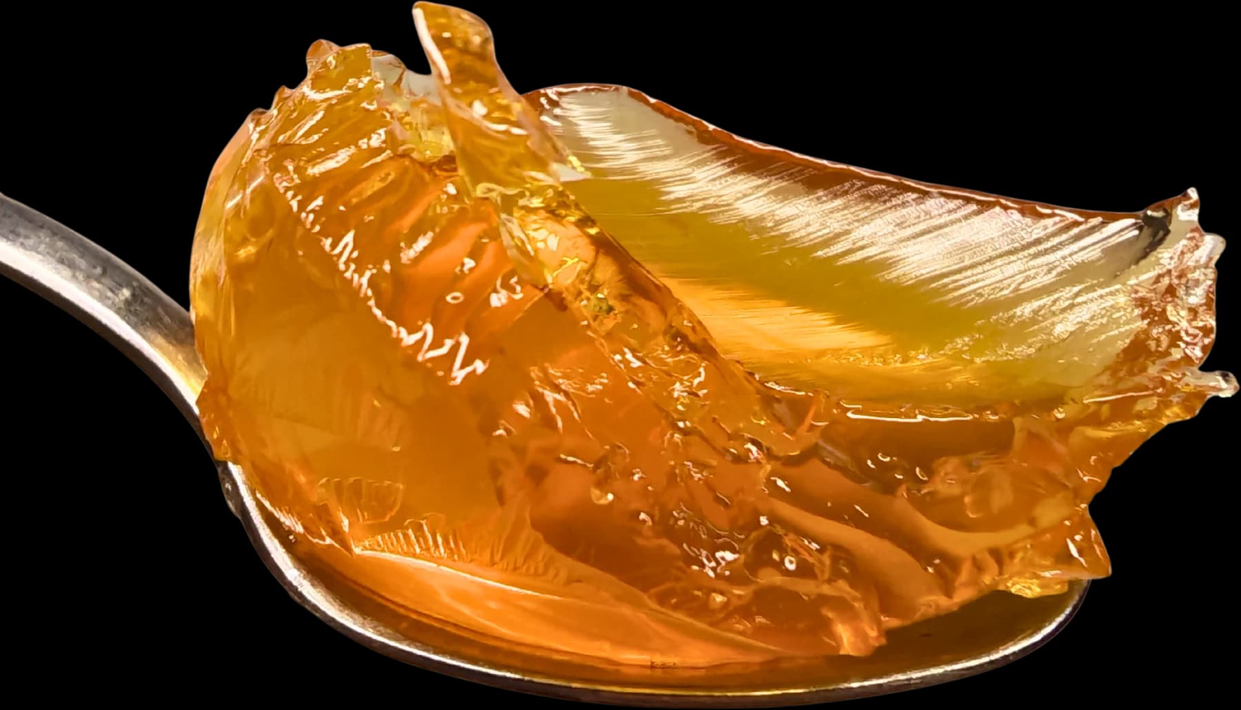 A single spoonful of the collagen jelly, lifted and set